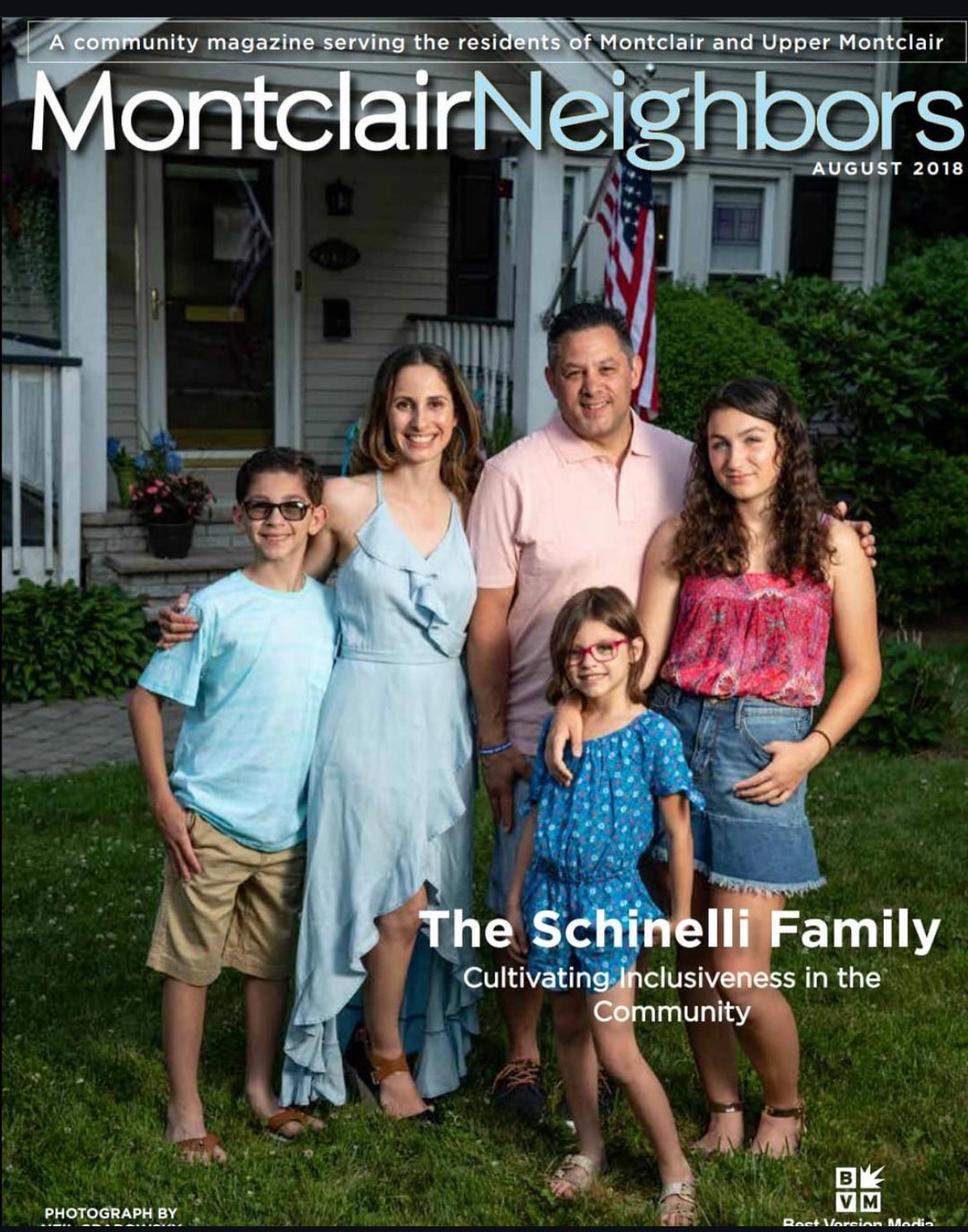 Kathiane posing with her family on the front of Montclair Neighbors magazine