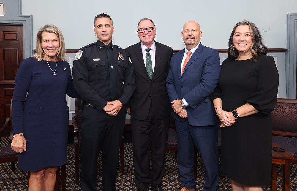 SCPS Dean stands with Charlottesville police chief, Virginia Senator, and others at a public safety event